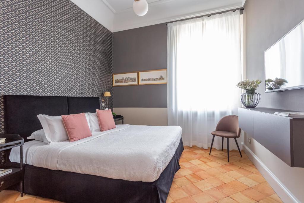 Postel nebo postele na pokoji v ubytování Hotel Parrasio