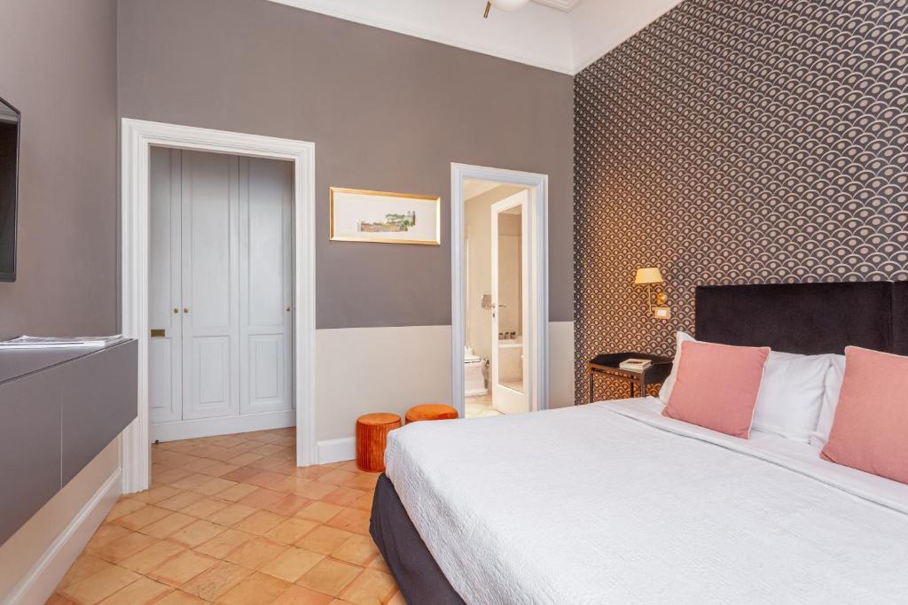 Postel nebo postele na pokoji v ubytování Hotel Parrasio