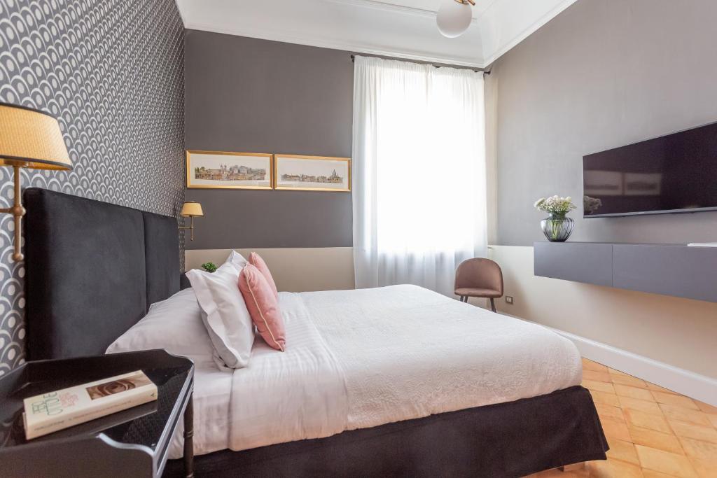 Postel nebo postele na pokoji v ubytování Hotel Parrasio