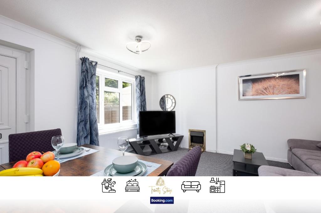 a living room with a couch and a table at Centrally Located 3 Bedroom House By Trinity Stays Short Lets & Serviced Accommodation Cambridge in Cambridge