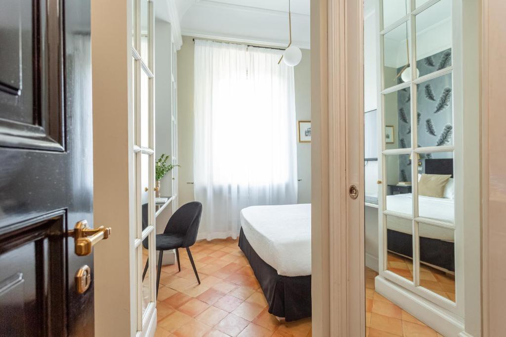 Postel nebo postele na pokoji v ubytování Hotel Parrasio