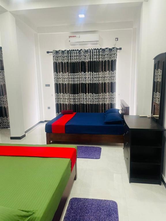Postel nebo postele na pokoji v ubytování Hotel Ceylonia Colombo
