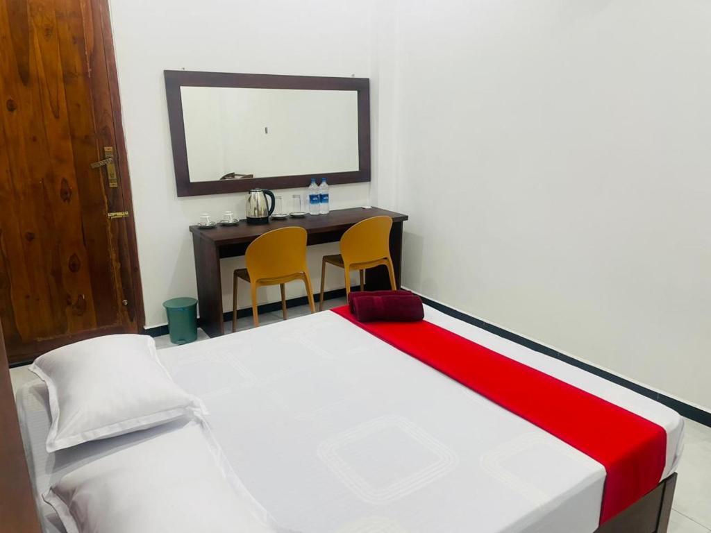 Postel nebo postele na pokoji v ubytování Hotel Ceylonia Colombo