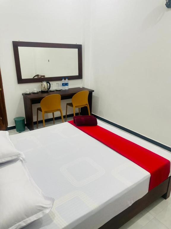 Postel nebo postele na pokoji v ubytování Hotel Ceylonia Colombo