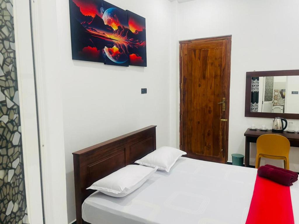 Postel nebo postele na pokoji v ubytování Hotel Ceylonia Colombo