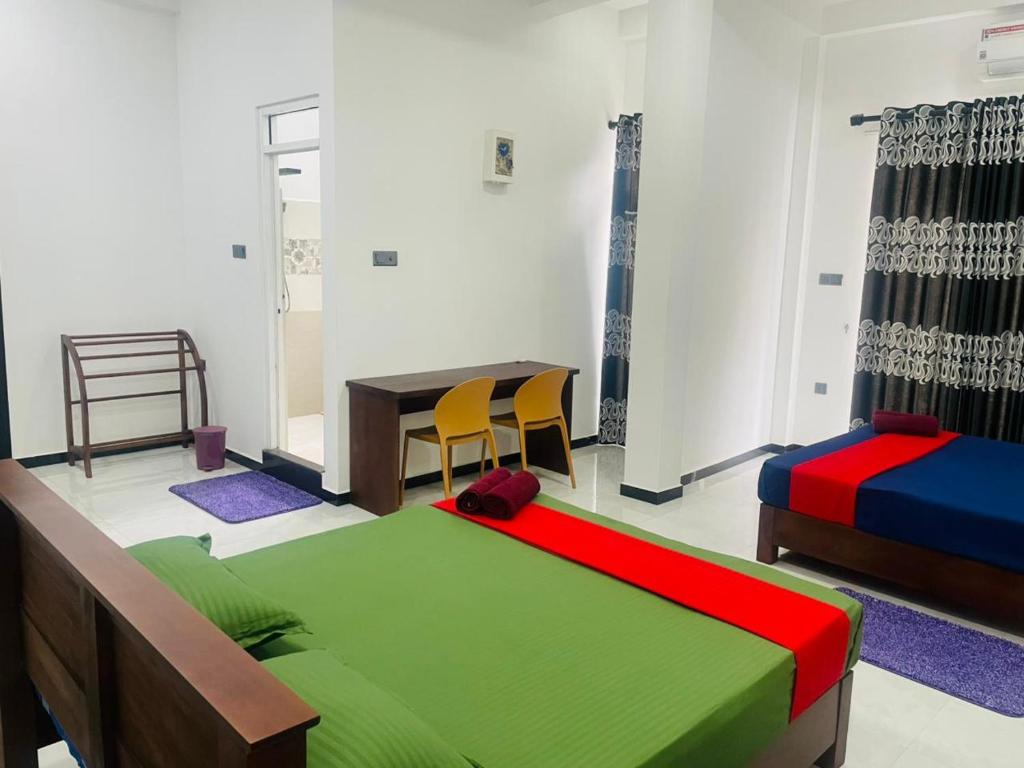 Postel nebo postele na pokoji v ubytování Hotel Ceylonia Colombo