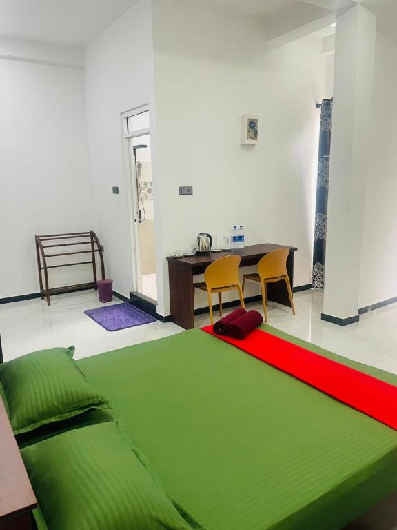 Postel nebo postele na pokoji v ubytování Hotel Ceylonia Colombo
