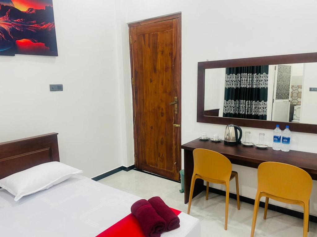Postel nebo postele na pokoji v ubytování Hotel Ceylonia Colombo