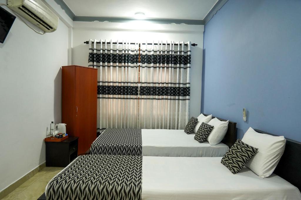 Postel nebo postele na pokoji v ubytování Blue Beach Hotel Trinco