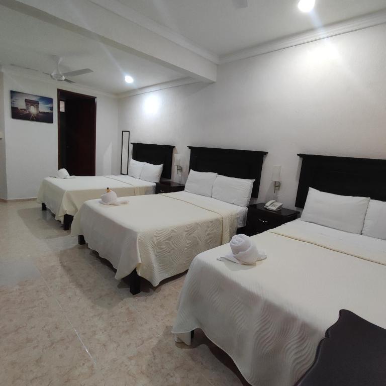 Postel nebo postele na pokoji v ubytování Hotel CEO Group
