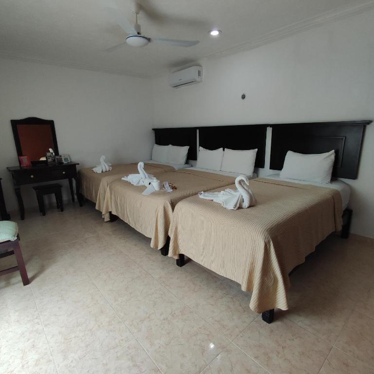 Postel nebo postele na pokoji v ubytování Hotel CEO Group
