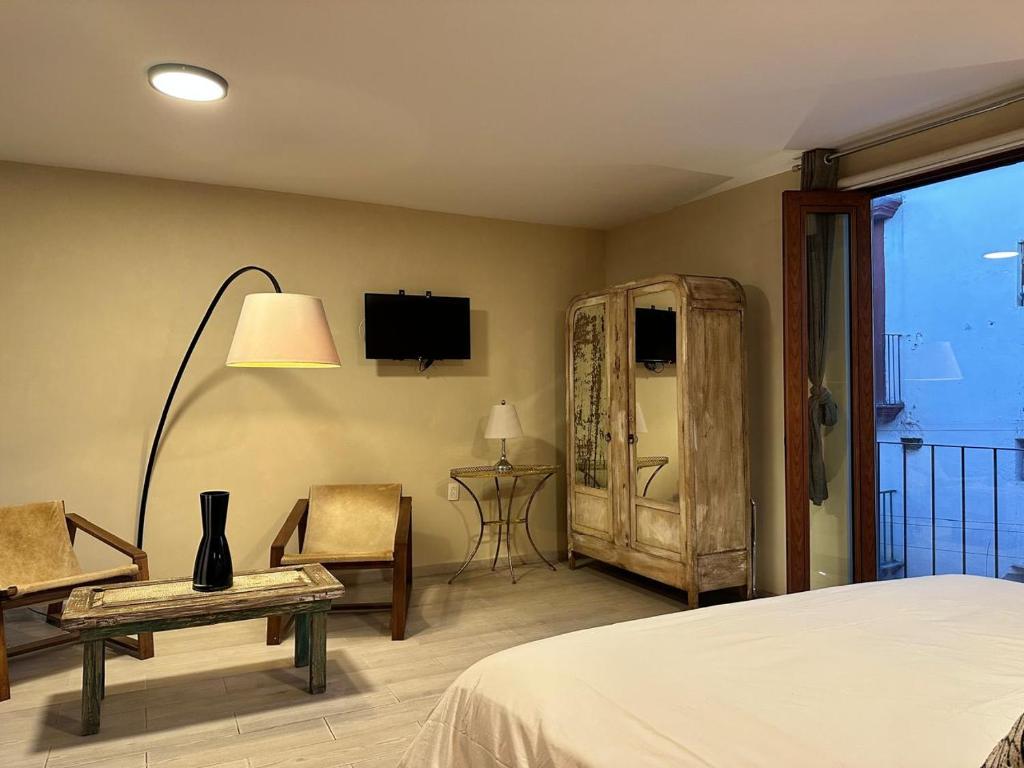 Postel nebo postele na pokoji v ubytování Casa Bakora Hotel