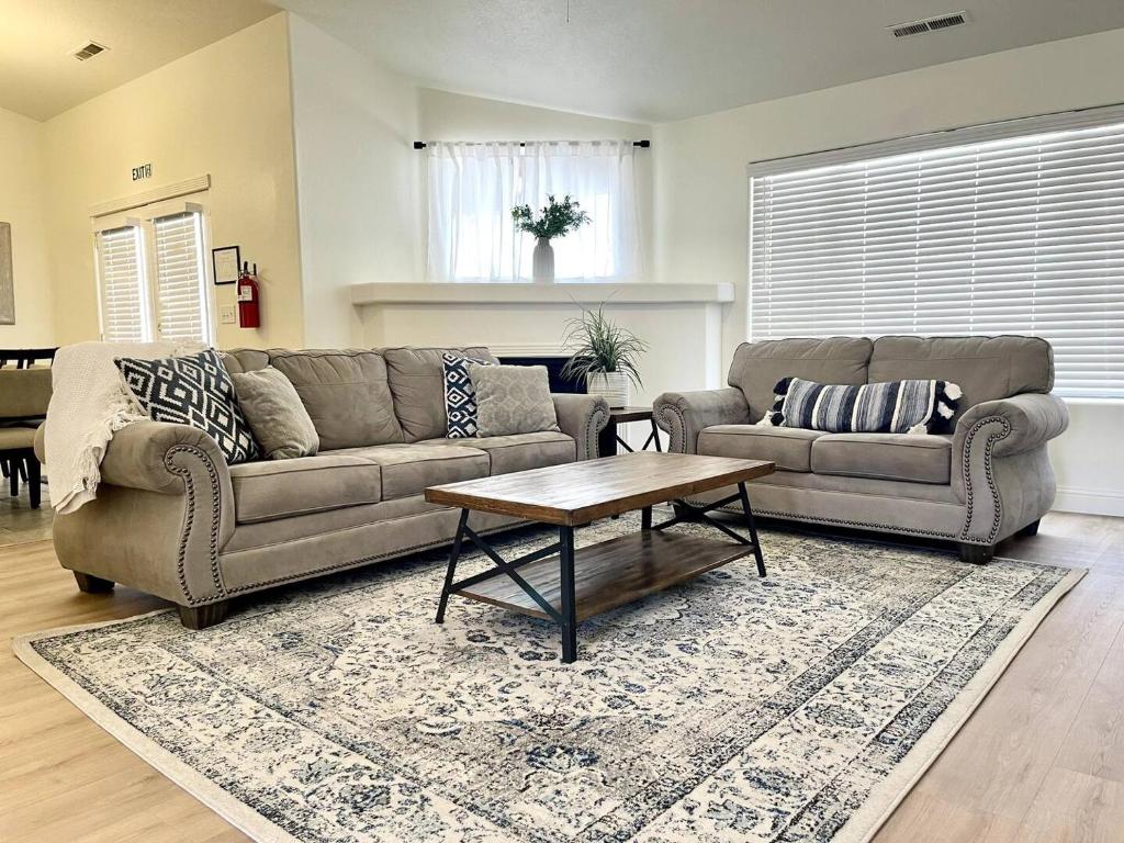 a living room with two couches and a coffee table at Newly Remodeled Home Near Zion - Patio & Grill in La Verkin