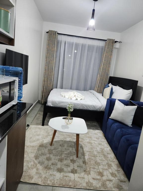 Ένα ή περισσότερα κρεβάτια σε δωμάτιο στο Comfort Haven Tsavo