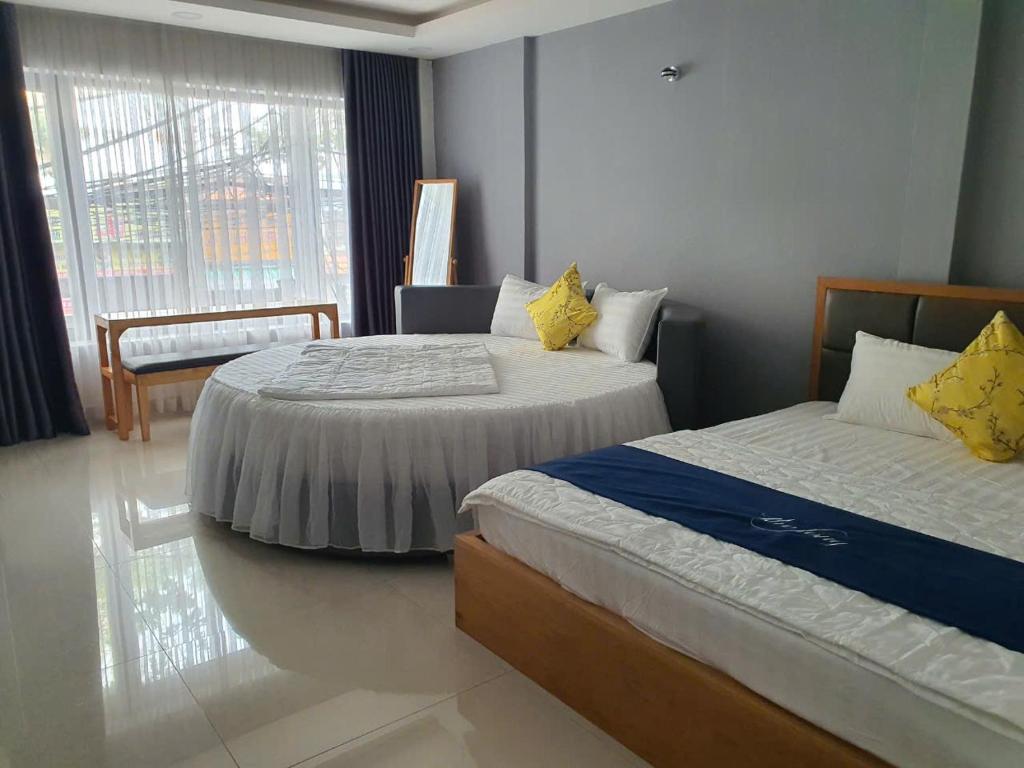 Postel nebo postele na pokoji v ubytování Hotel & Homestay LABUBU