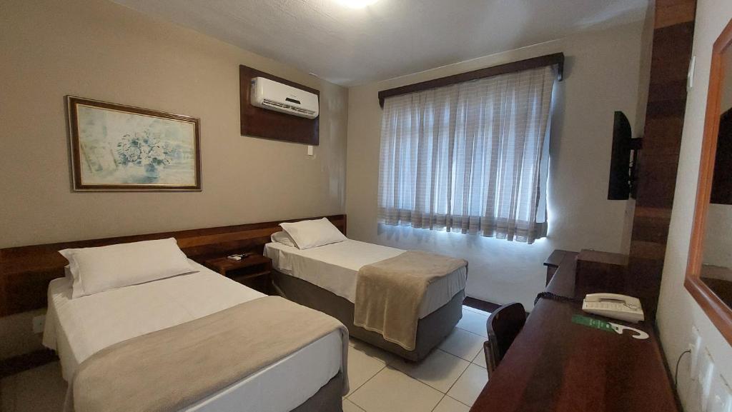 Postel nebo postele na pokoji v ubytování Príncipe Hotel