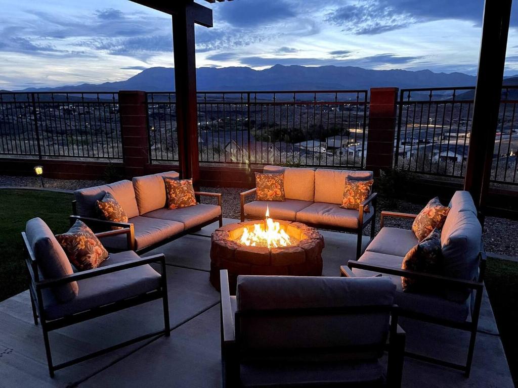 a patio with couches and a table and a fire pit at Near Zion Sunset Views Sleeps 8 Fire Pit in La Verkin