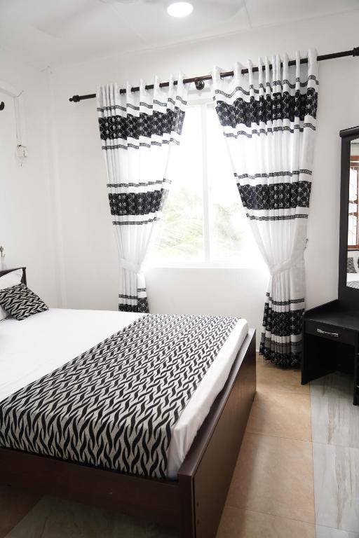 Postel nebo postele na pokoji v ubytování Blue Beach Hotel Trinco