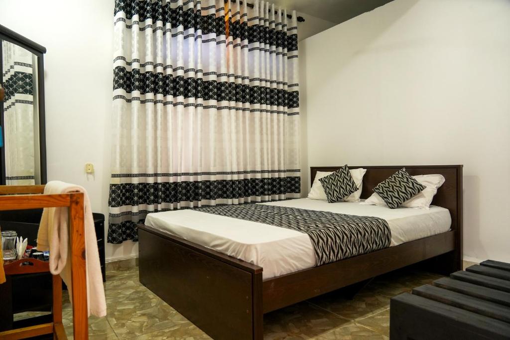 Postel nebo postele na pokoji v ubytování Blue Beach Hotel Trinco