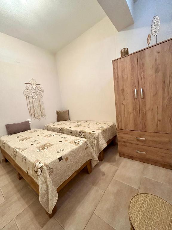 Postel nebo postele na pokoji v ubytování SK studios & apartments