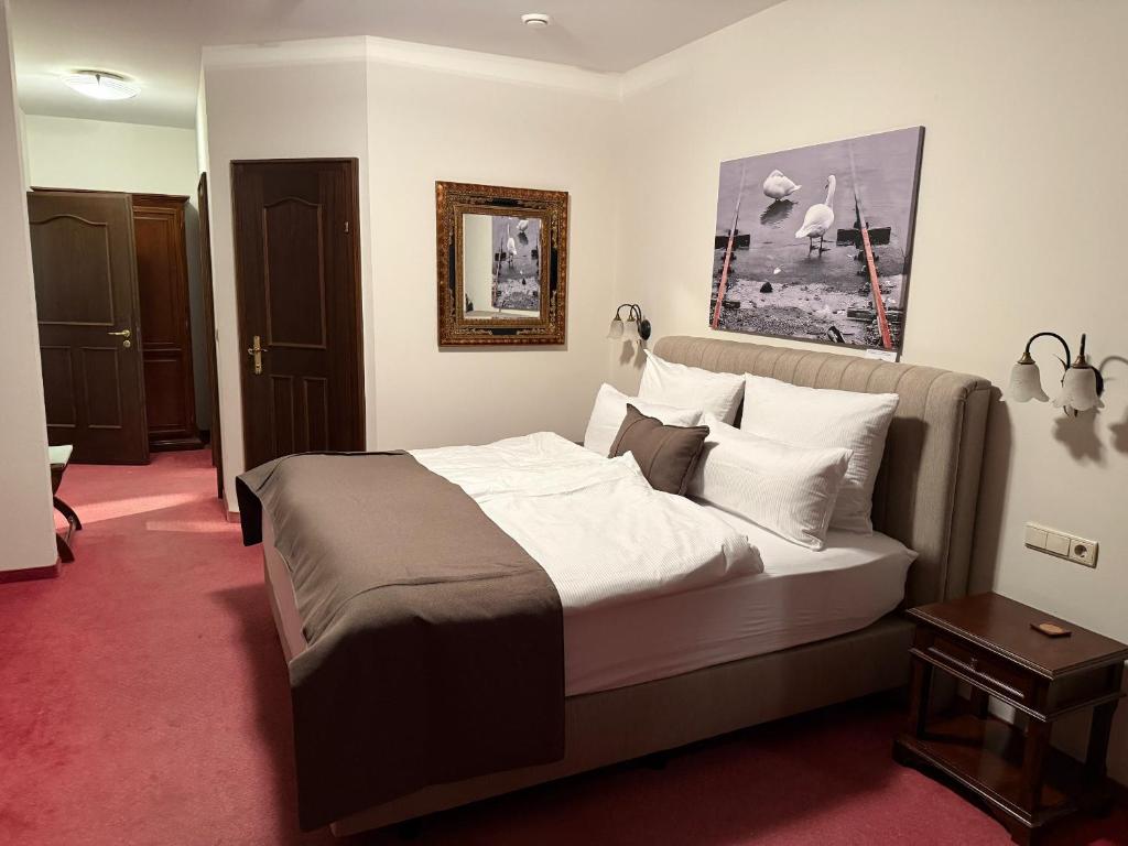 Postel nebo postele na pokoji v ubytování Hotel Kaiser