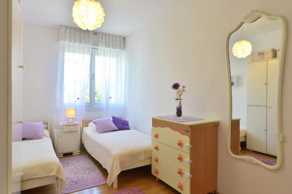 Posteľ alebo postele v izbe v ubytovaní Cozy beach apartment Split
