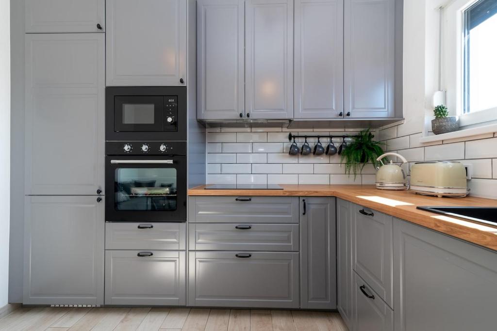Kuchyňa alebo kuchynka v ubytovaní Apartman Špiro