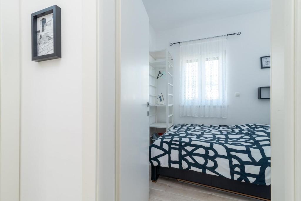 Posteľ alebo postele v izbe v ubytovaní Apartman Špiro