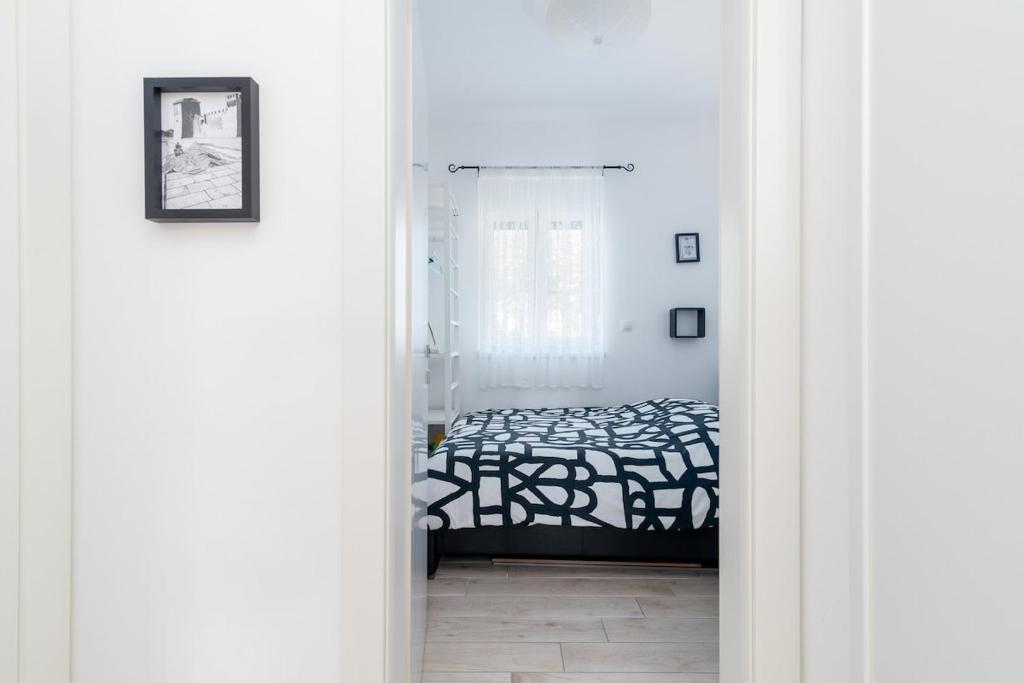Posteľ alebo postele v izbe v ubytovaní Apartman Špiro