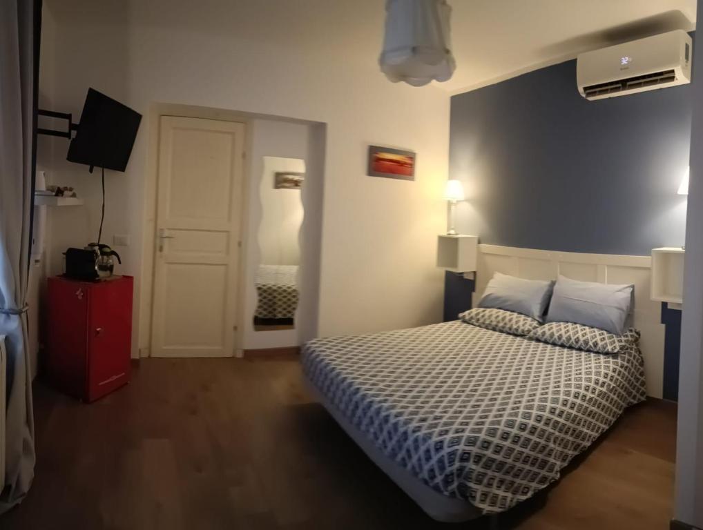 Postel nebo postele na pokoji v ubytování B&B SAN FRANCESCO Pescara Centro