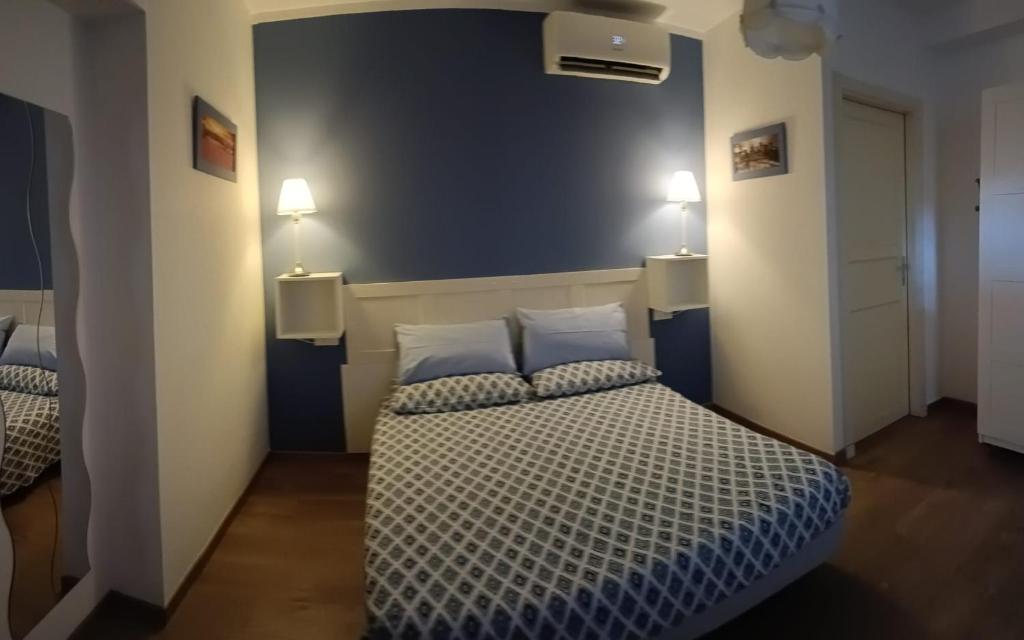Postel nebo postele na pokoji v ubytování B&B SAN FRANCESCO Pescara Centro