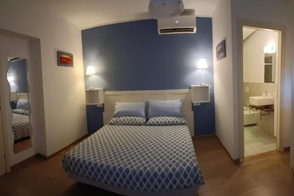 Postel nebo postele na pokoji v ubytování B&B SAN FRANCESCO Pescara Centro