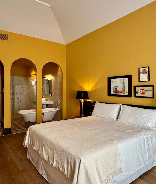 Postel nebo postele na pokoji v ubytování Hotel Divino & Aparthotel