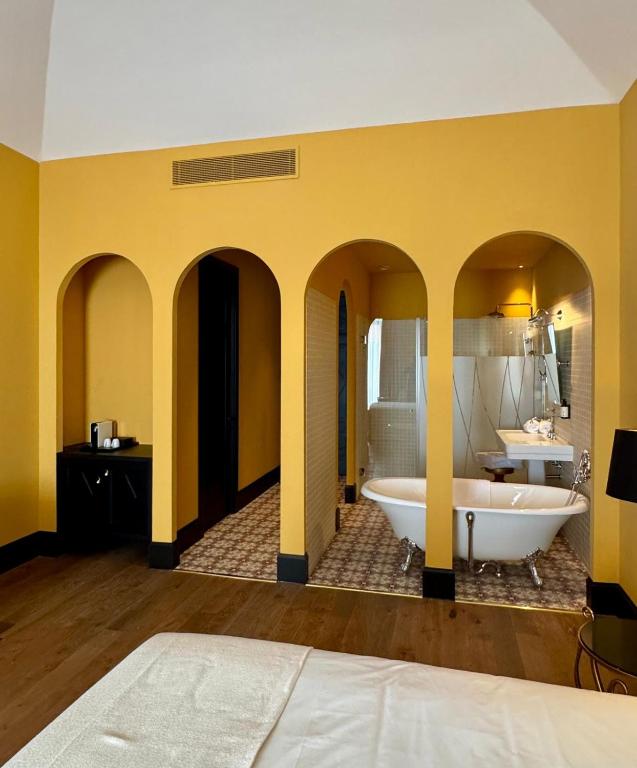 Koupelna v ubytování Hotel Divino & Aparthotel