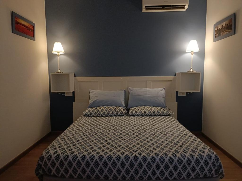 Postel nebo postele na pokoji v ubytování B&B SAN FRANCESCO Pescara Centro