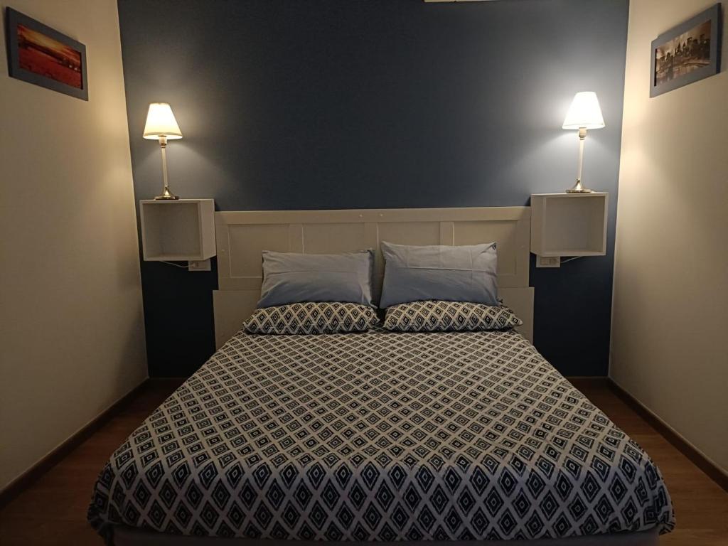 Postel nebo postele na pokoji v ubytování B&B SAN FRANCESCO Pescara Centro