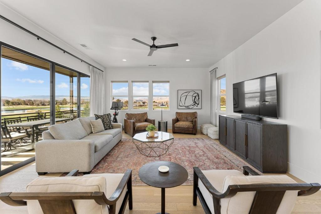 a living room with a couch and a tv at Villa #20 at Bloomington Country Club condo in St. George