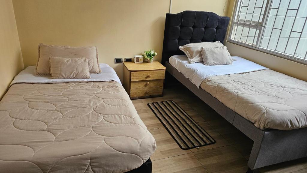 Postel nebo postele na pokoji v ubytování Colisseum Roma House - Turin- Campin Movistar Embajada cubo colsubsidio
