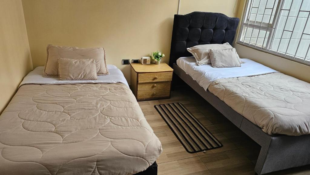 Postel nebo postele na pokoji v ubytování Colisseum Roma House - Turin- Campin Movistar Embajada cubo colsubsidio