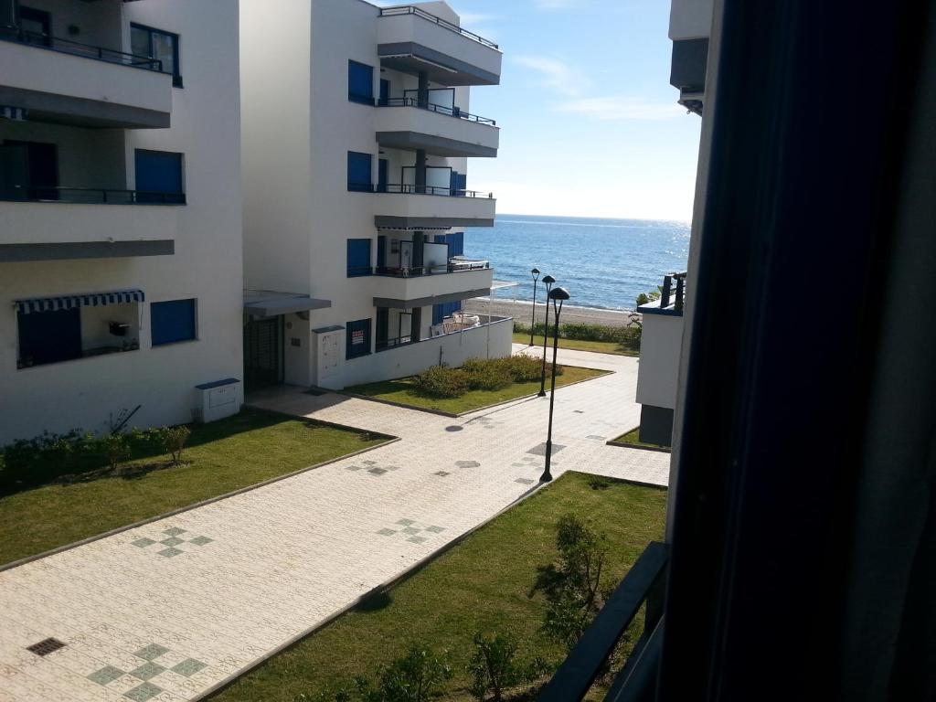 a view of the ocean from a building at Apartamento Castillo Bajo in Torrox Costa