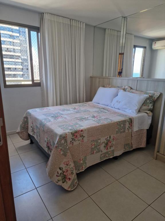 Ένα ή περισσότερα κρεβάτια σε δωμάτιο στο Flat Praia Dourada
