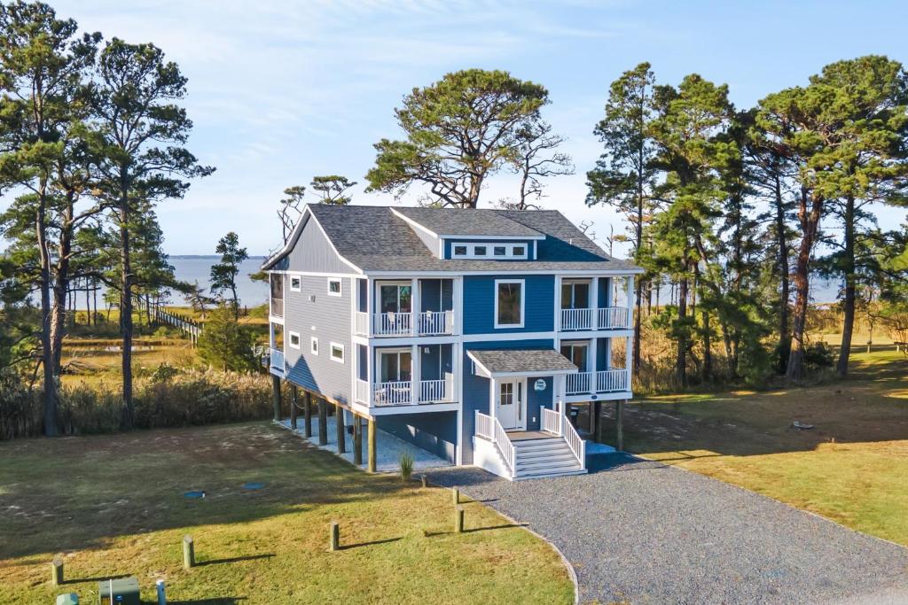 an aerial view of a blue and white house at Wildcat Haven - Waterfront & phenomenal views! in Deep Hole