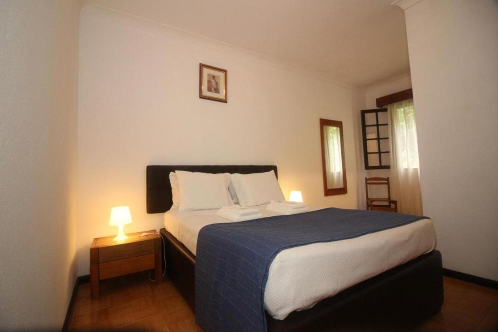 Postel nebo postele na pokoji v ubytování Serrana Gerês Inn