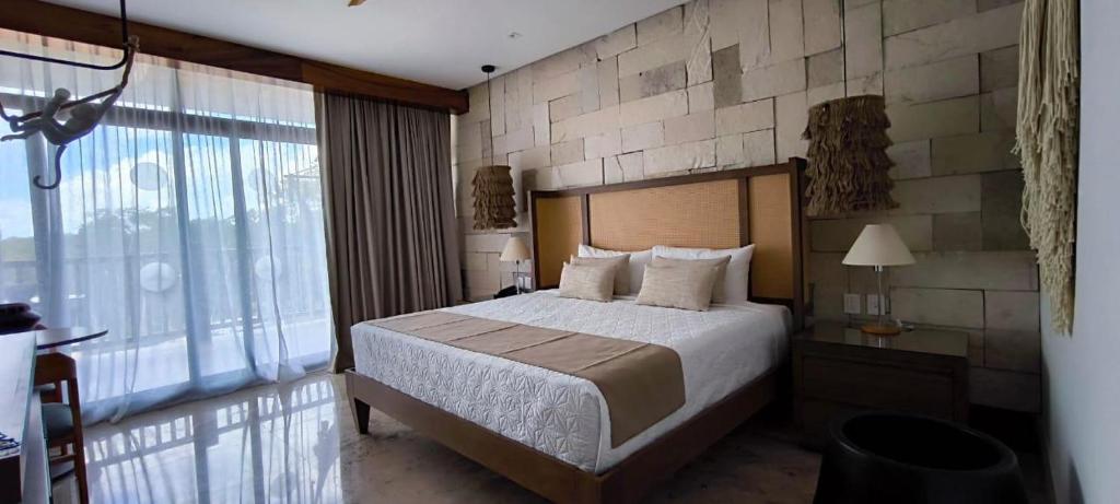 Postel nebo postele na pokoji v ubytování Hotel Mundo Maya Chichén Itzá