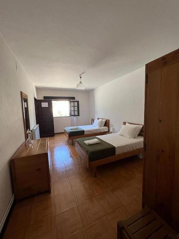 Postel nebo postele na pokoji v ubytování Serrana Gerês Inn