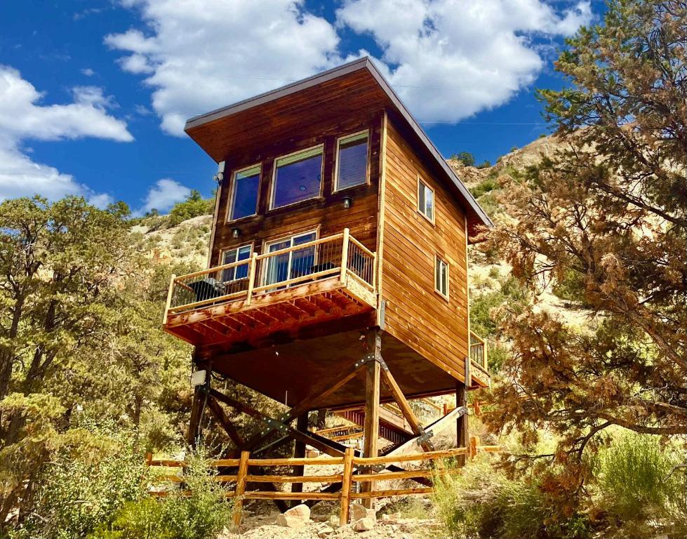 a tree house on a stand in the woods at Treetop #7 at East Zion Resort in Orderville