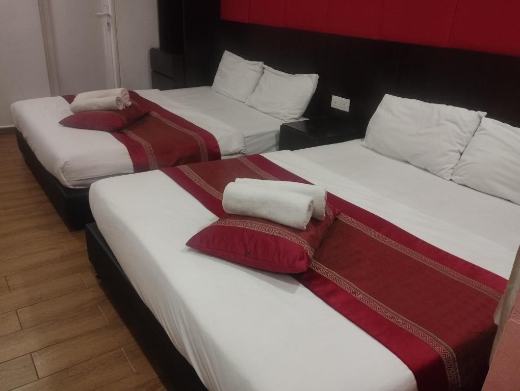 Postel nebo postele na pokoji v ubytování D'Spark Hotel Bayu