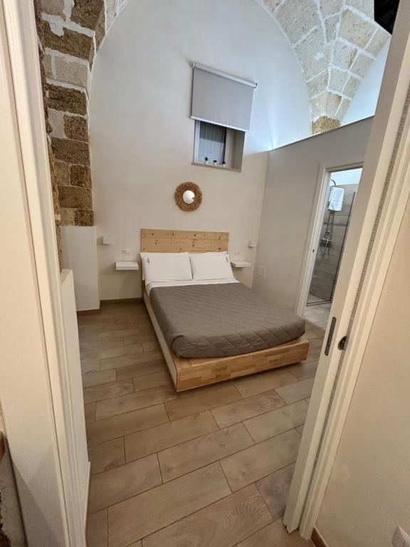 Postel nebo postele na pokoji v ubytování Castrum Rooms