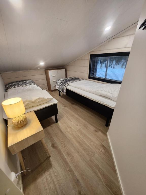 Ένα ή περισσότερα κρεβάτια σε δωμάτιο στο Levin Huvilompolo