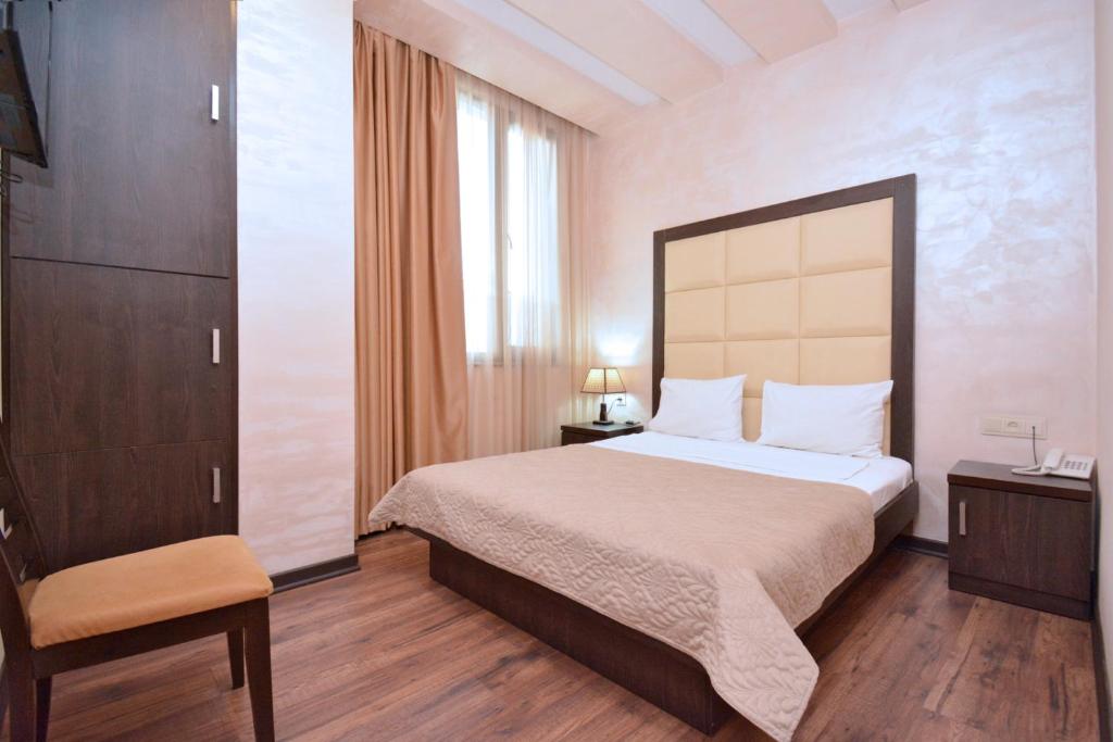 Postel nebo postele na pokoji v ubytování Partez Boutique Hotel